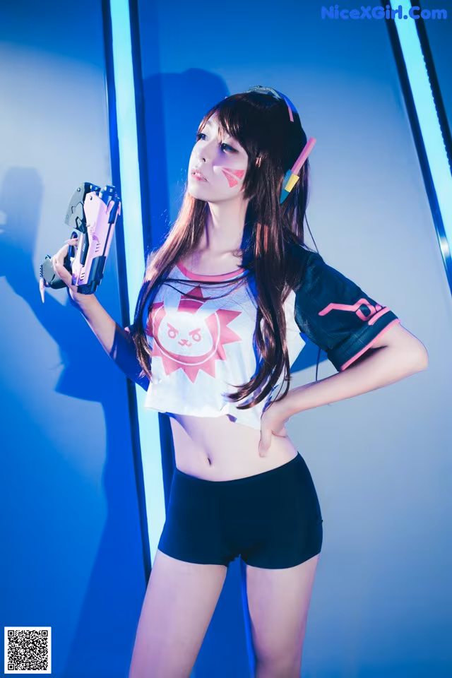 A woman in a white shirt and black shorts holding a toy gun.